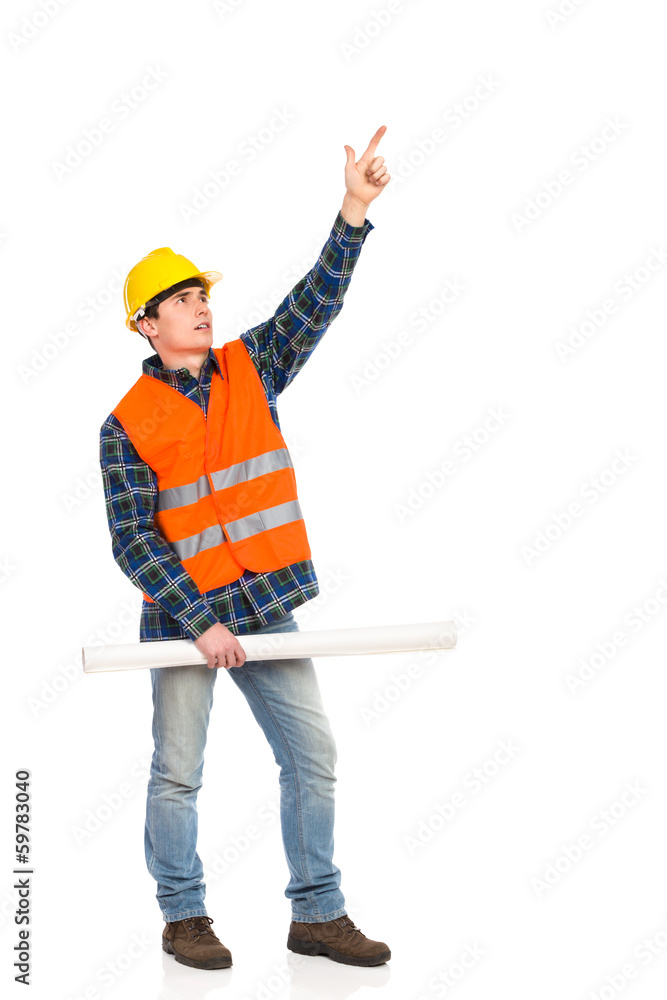 Construction worker holding rolled paper plan and pointing up. Construction worker holding rolled paper plan and pointing up.