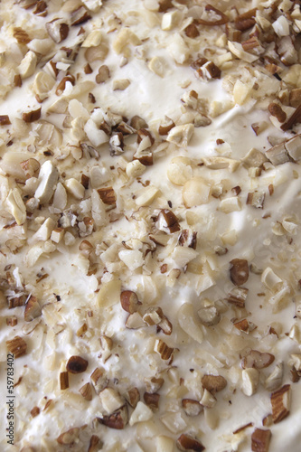 Close Up of Chopped Mixed Nuts And Whipped Cream On Christmas Tr