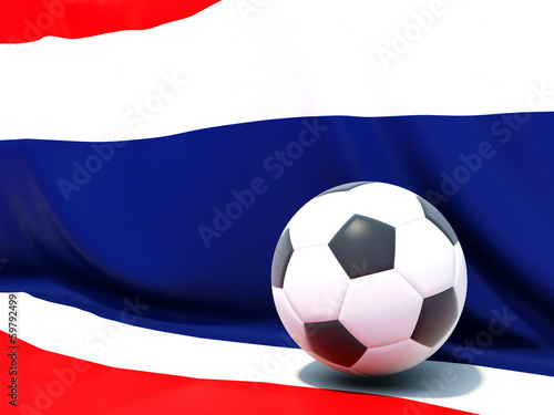 Flag of thailand with football in front of it