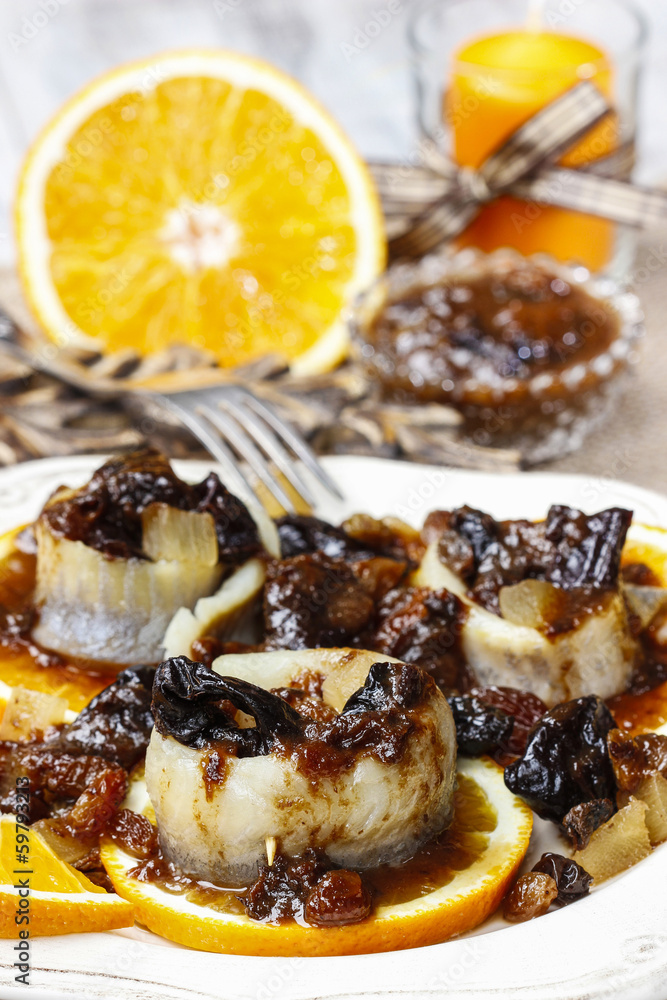 Pickled herring rolls with dried fruits and plum sauce Pickled herring rolls with dried fruits and plum sauce