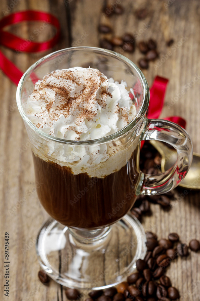 Irish coffee on wooden table among coffee beans Irish coffee on wooden table among coffee beans