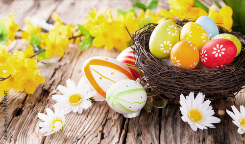 Easter colored eggs on wood photo