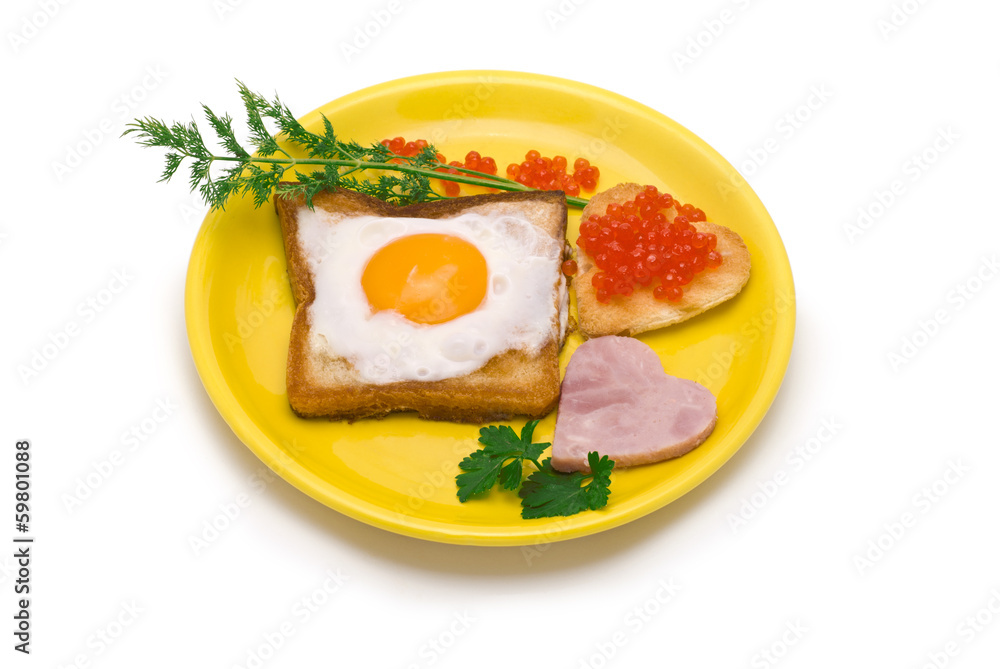 Romantic Breakfast: toast, egg, heart-shaped ham and red caviar Romantic Breakfast: toast, egg, heart-shaped ham and red caviar