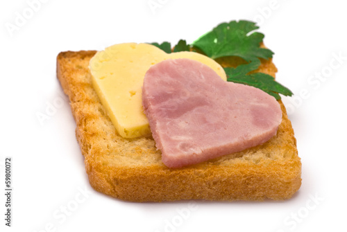 Toast with heart-shaped Ham and Cheese isolated on white