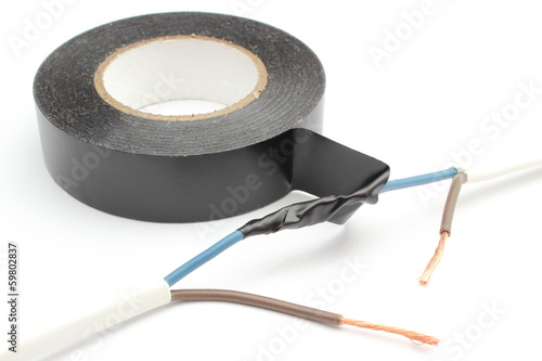Fotografia Repair of electrical cable using insulating tape.