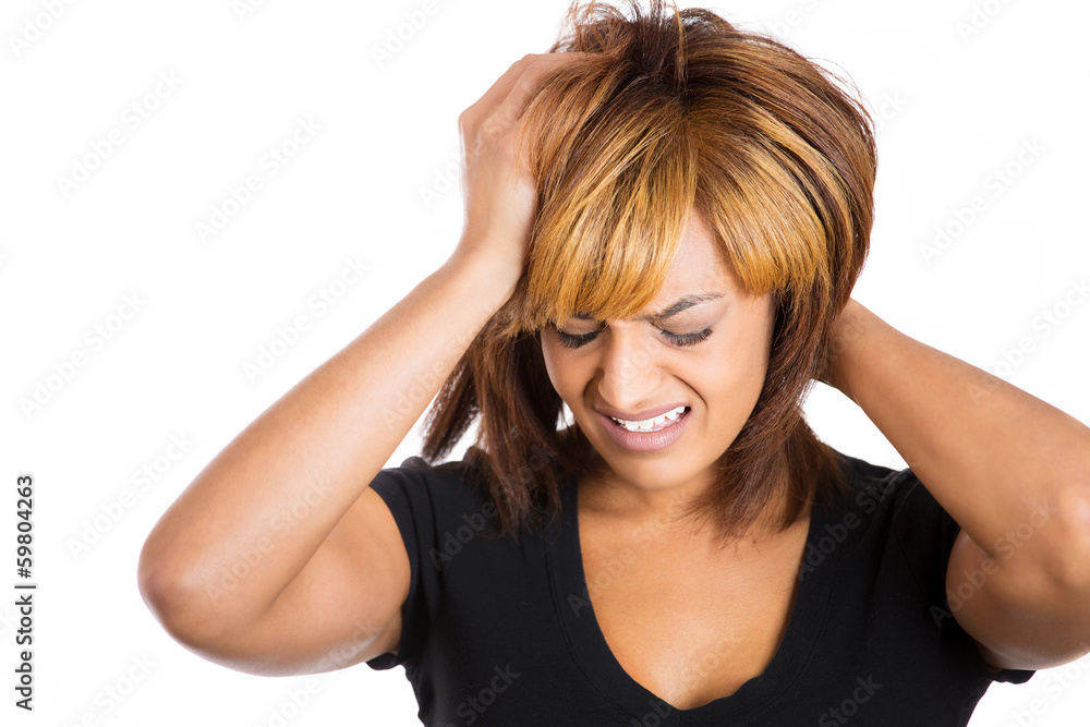 Woman stressed is going crazy pulling her hair in frustration Woman stressed is going crazy pulling her hair in frustration