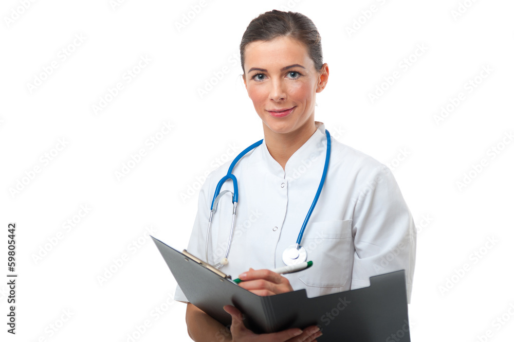 Closeup portrait of female doctor making a note on clipboard Closeup portrait of female doctor making a note on clipboard