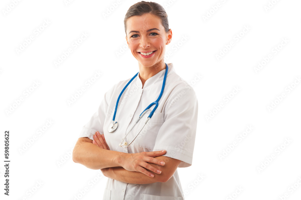 Smiling Woman doctor with arms crossed stands over white backgro Smiling Woman doctor with arms crossed stands over white backgro