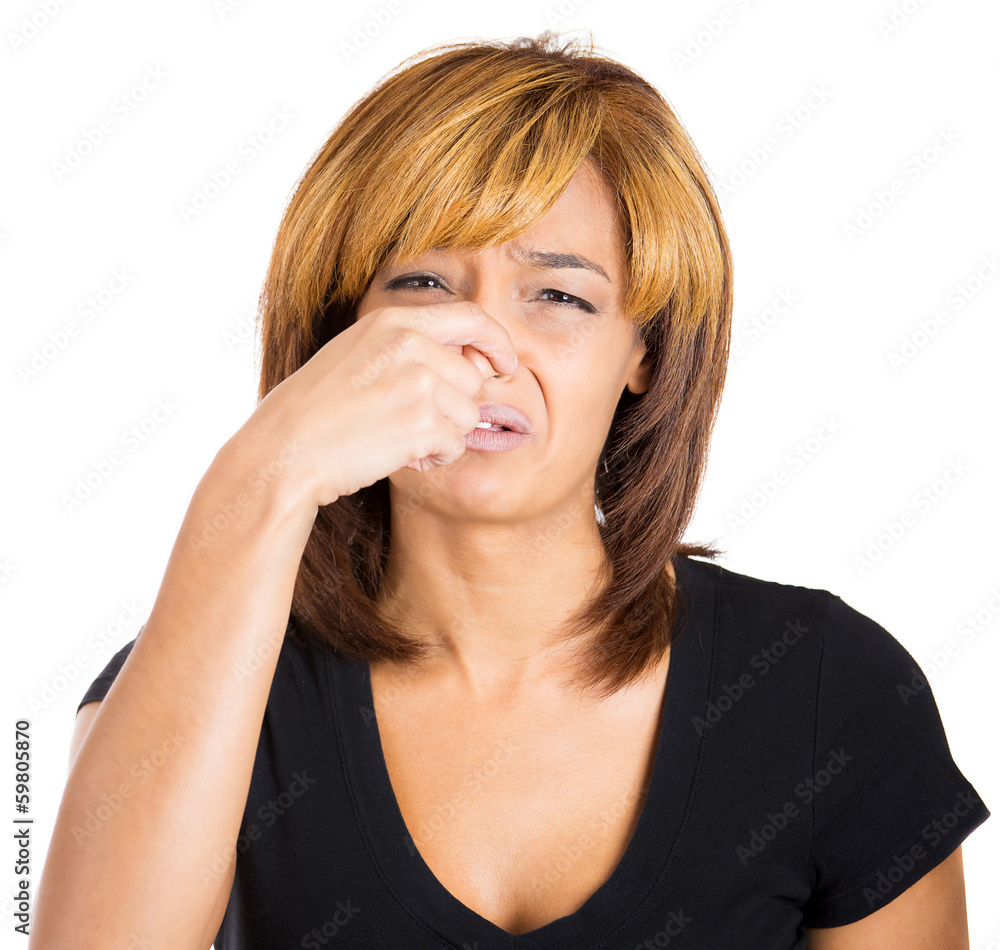 Woman pinches her nose, something stinks, very bad smell Woman pinches her nose, something stinks, very bad smell