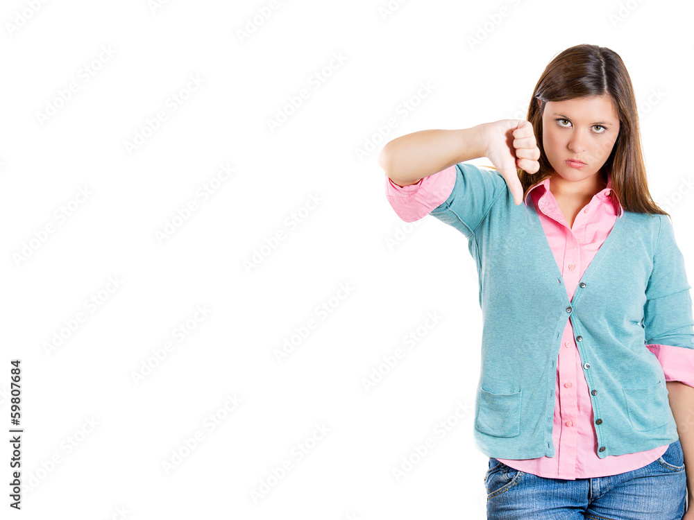 Unhappy, sad woman giving thumbs down Unhappy, sad woman giving thumbs down