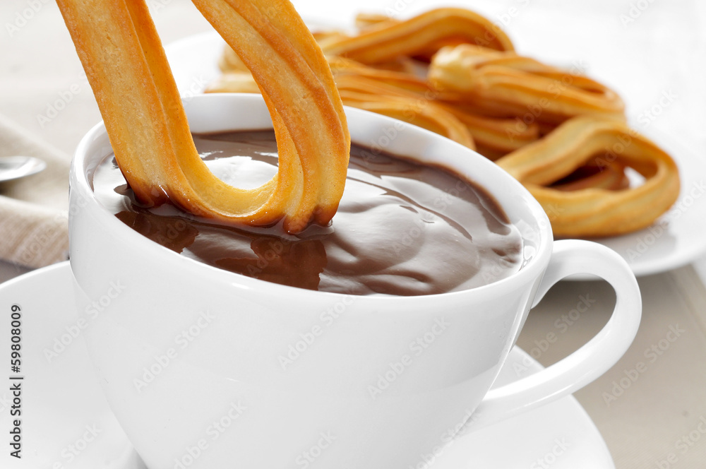 Ταπετσαρία churros con chocolate, a typical Spanish sweet snack
