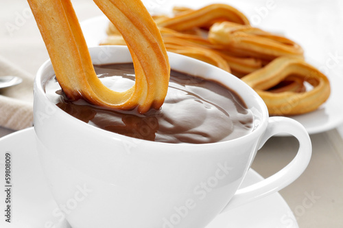 churros con chocolate, a typical Spanish sweet snack photo