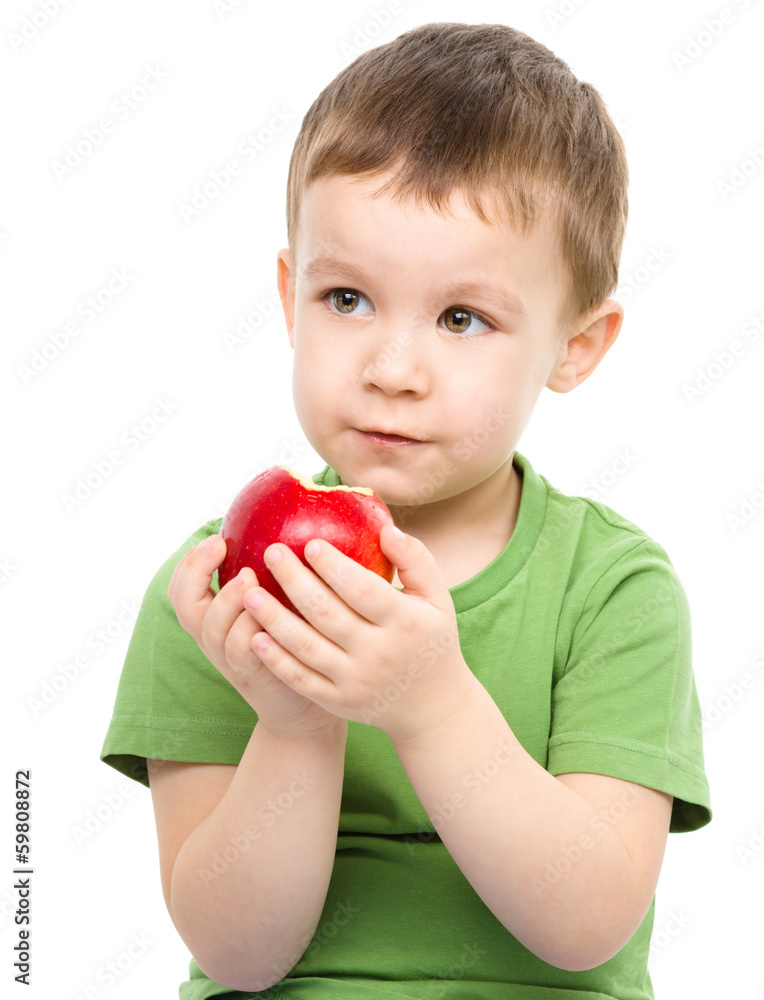 Portrait of a cute little boy with red apple Portrait of a cute little boy with red apple