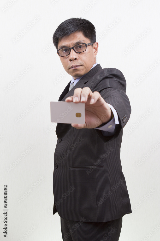 Businessman holding a credit card. Businessman holding a credit card.
