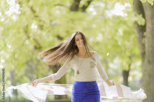 Young woman at the autumn park