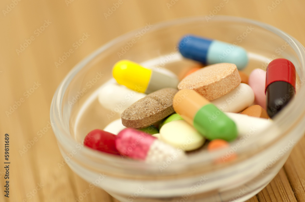Various drugs (tablets, pills, capsules) in small salad bowl Various drugs (tablets, pills, capsules) in small salad bowl
