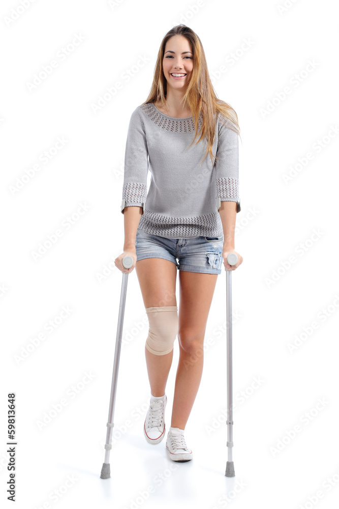Front view of a woman walking with crutches Front view of a woman walking with crutches