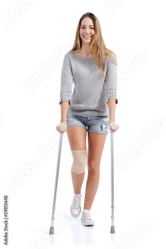 Fotobehang Front view of a woman walking with crutches