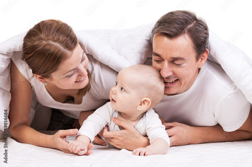 Closeup of young family with baby boy against white background Closeup of young family with baby boy against white background