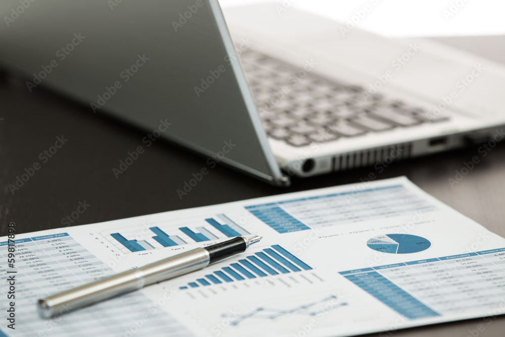 Businessman analyzing investment charts Businessman analyzing investment charts