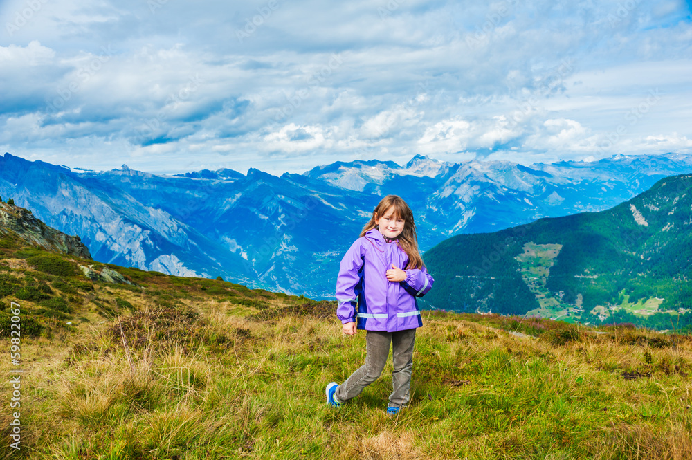 Cute little girl in mountains