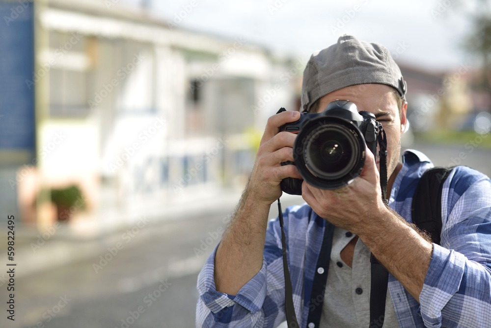 Photographer shooting outdoors scenery Photographer shooting outdoors scenery