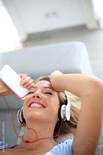Woman relaxing with music headphones on