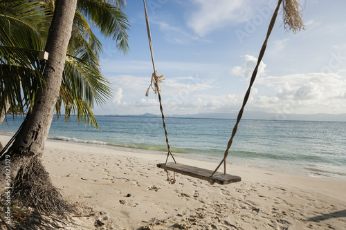Rope swing on beach, Koh Pha Ngan, Thailand © moodboard