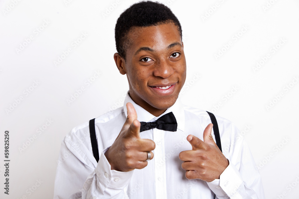 Portrait of young man pointing over white background Portrait of young man pointing over white background
