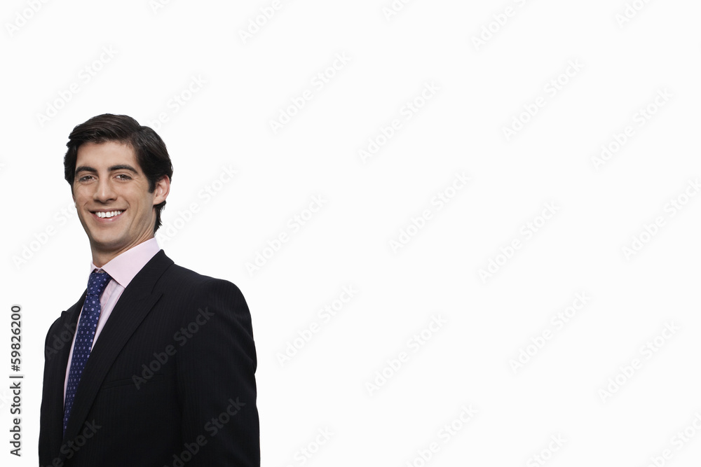 Portrait of happy young businessman against white background Portrait of happy young businessman against white background