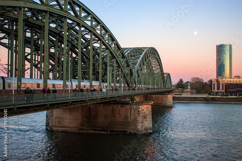 Hohenzollern Bridge and the Moon in Cologne, Germany © Matyas Rehak
