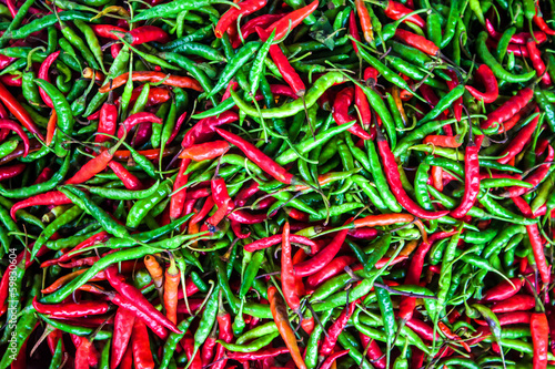 Background of red and green chilli peppers © Matyas Rehak