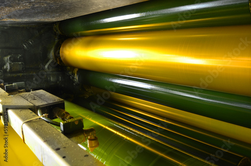 Photography print machine, yellow color drum, dramatic light