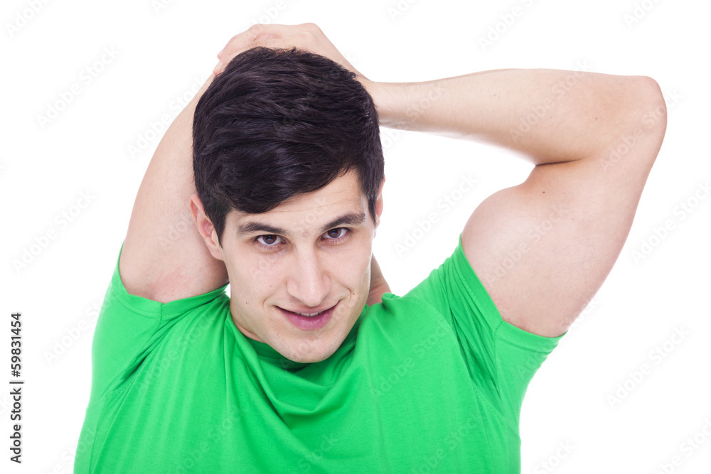 Athletic man stretching the arms, isolated over a white backgrou Athletic man stretching the arms, isolated over a white backgrou