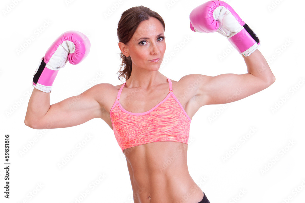 A beautiful young woman ready for a kickboxing exercise A beautiful young woman ready for a kickboxing exercise