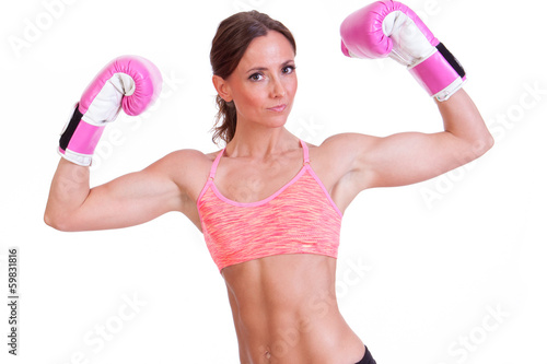 A beautiful young woman ready for a kickboxing exercise