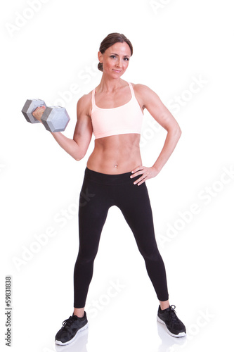 A beautiful young woman ready for weightlifting exercise