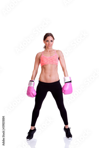 A beautiful young woman ready for a kickboxing exercise