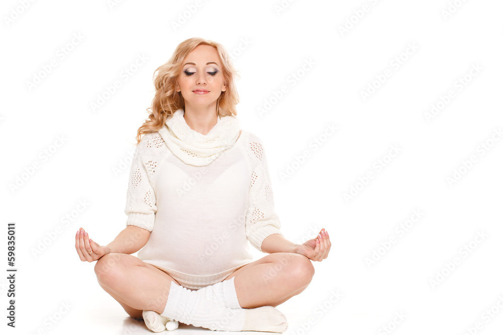 Portrait of a pregnant woman in a white scarf on white Portrait of a pregnant woman in a white scarf on white