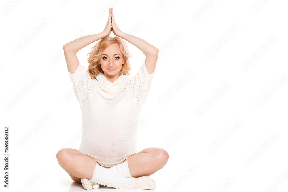 Portrait of a pregnant woman in a white scarf on white Portrait of a pregnant woman in a white scarf on white