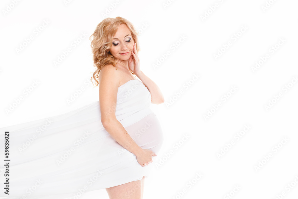 Portrait of a pregnant woman in a white scarf on white Portrait of a pregnant woman in a white scarf on white