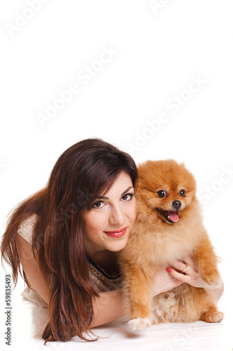 Happy woman with a beautiful dog - isolated over white © GTeam