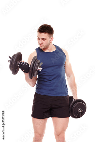 Handsome man working out with dumbbells