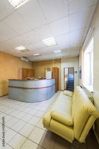 The reception with leather sofa in a modern office building photo