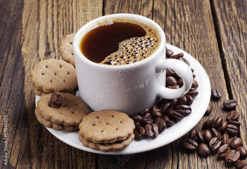 Cup of hot coffee and chocolate cookies