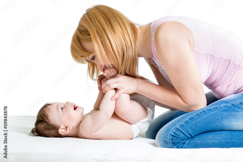 joyful mother playing with her baby infant joyful mother playing with her baby infant