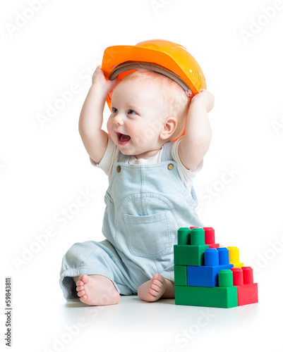 kid playing with building b...