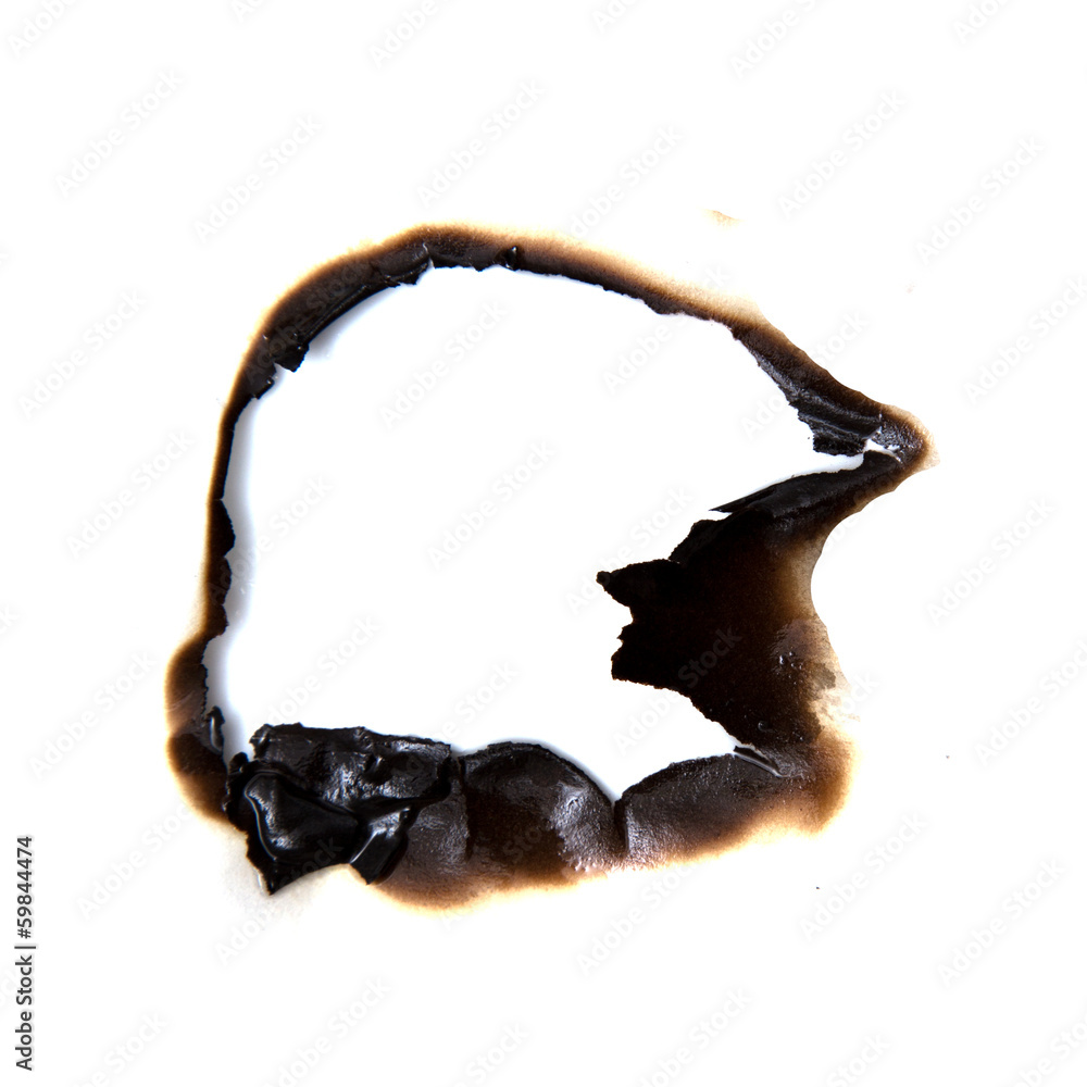 Fototapeta premium burned hole on a white paper background