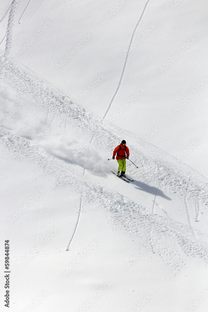 Skier in deep powder, extreme freeride Skier in deep powder, extreme freeride