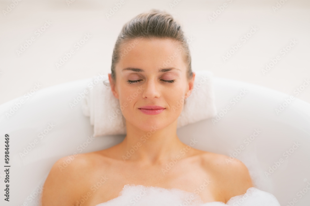 Young woman relaxing in bathtub Young woman relaxing in bathtub